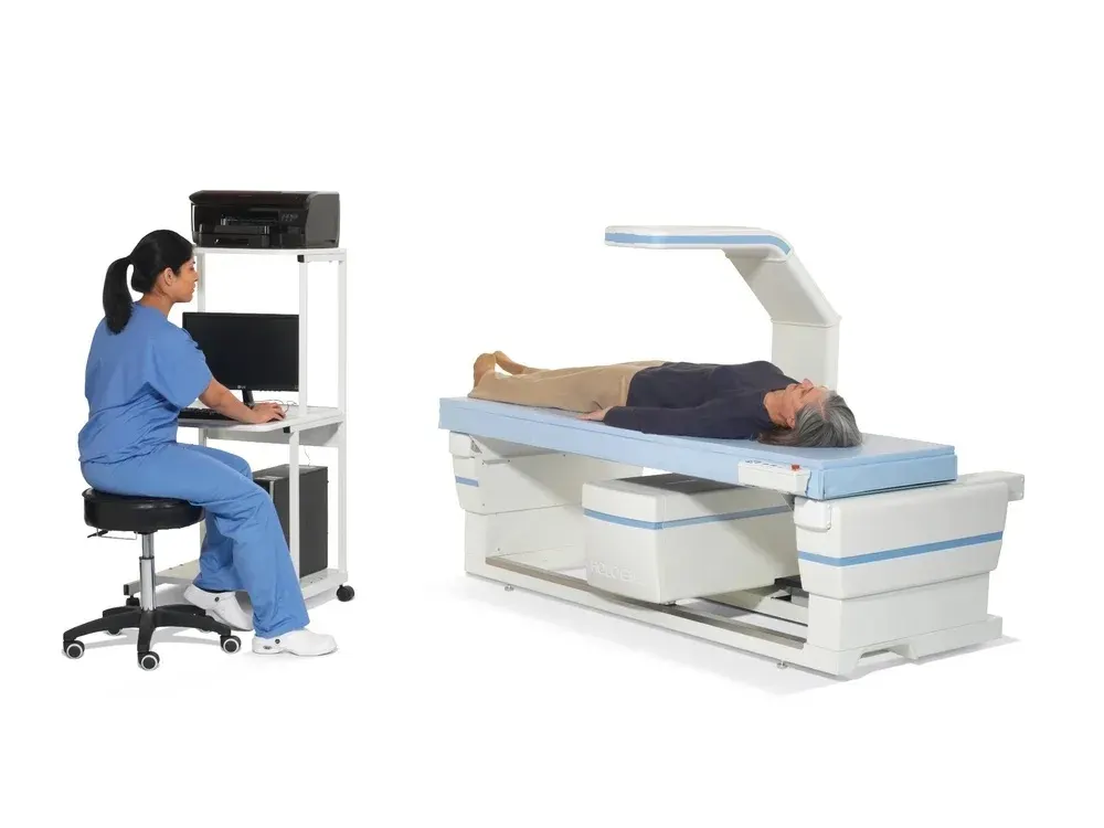 Patient lying still on a DEXA scan table during a body composition and bone density test at a longevity clinic