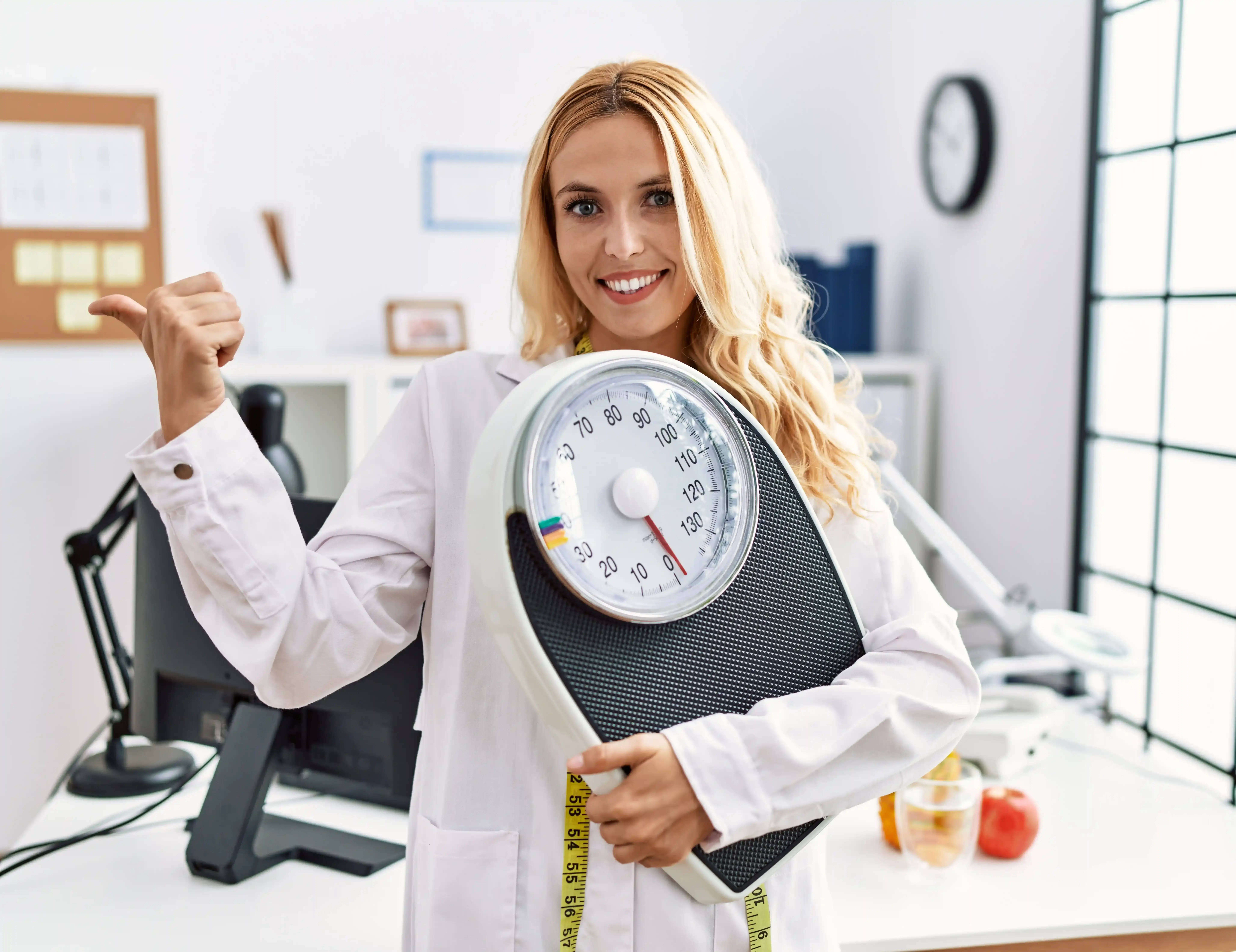 Confident patient discussing weight loss package candidacy at Bodiatrics in Suwanee, GA
