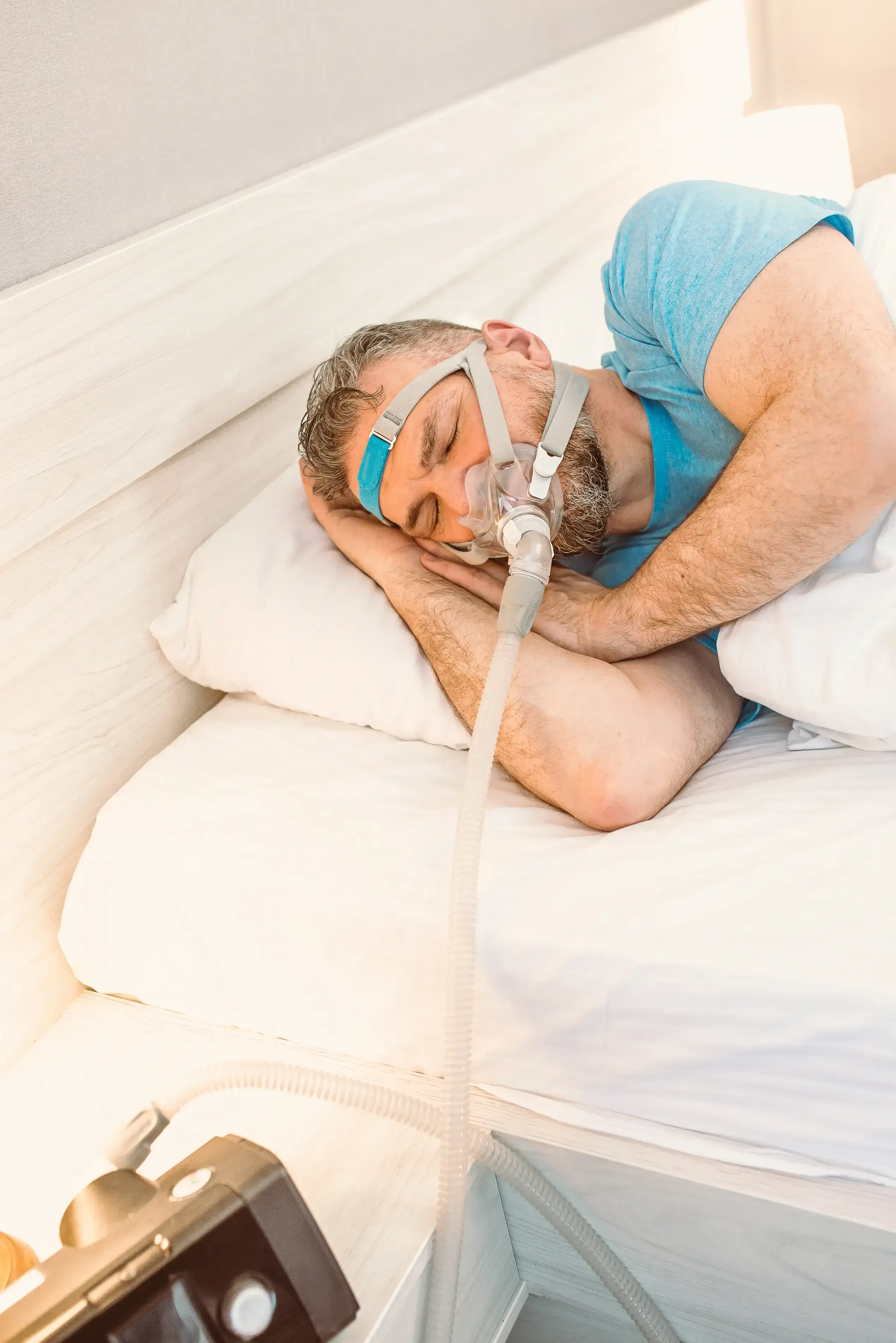Adult experiencing daytime fatigue, a common symptom of obstructive sleep apnea